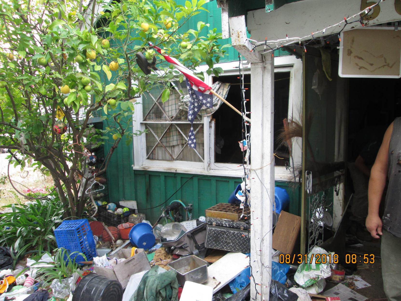 Garbage outside a Napa hoarder house (before)